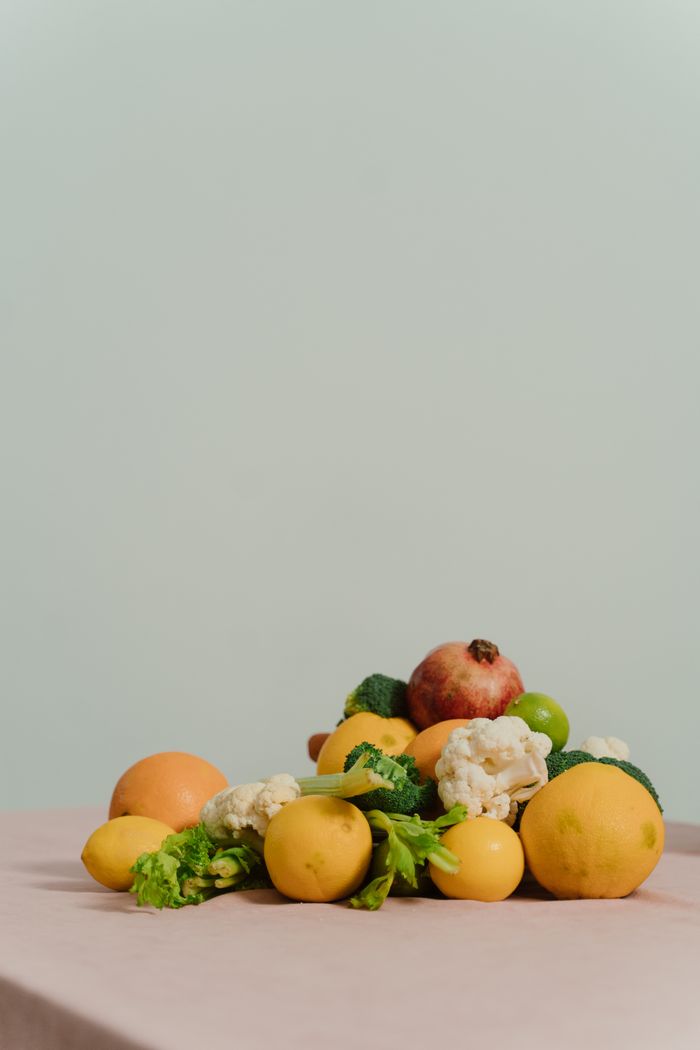 Colorful organic fruits and vegetables arranged on a table with ample copyspace.